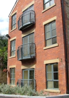 Galvanised and painted steel balconies for new build development, fabricated and installed by Luke Lister Blacksmiths