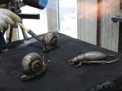 Hand crafting the snails, frogs and other creatures
